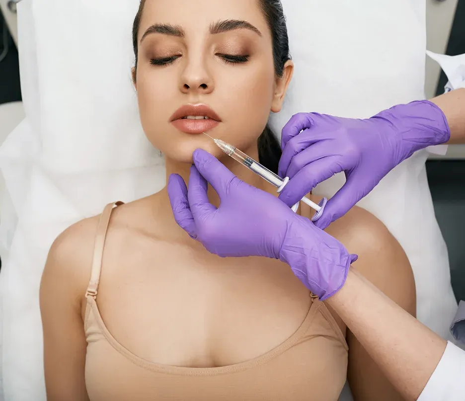 a woman getting lip fillers